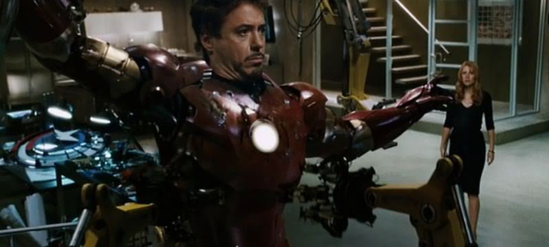 Captain America's shield , just behind Iron Man (Tony Stark) on his workbench.